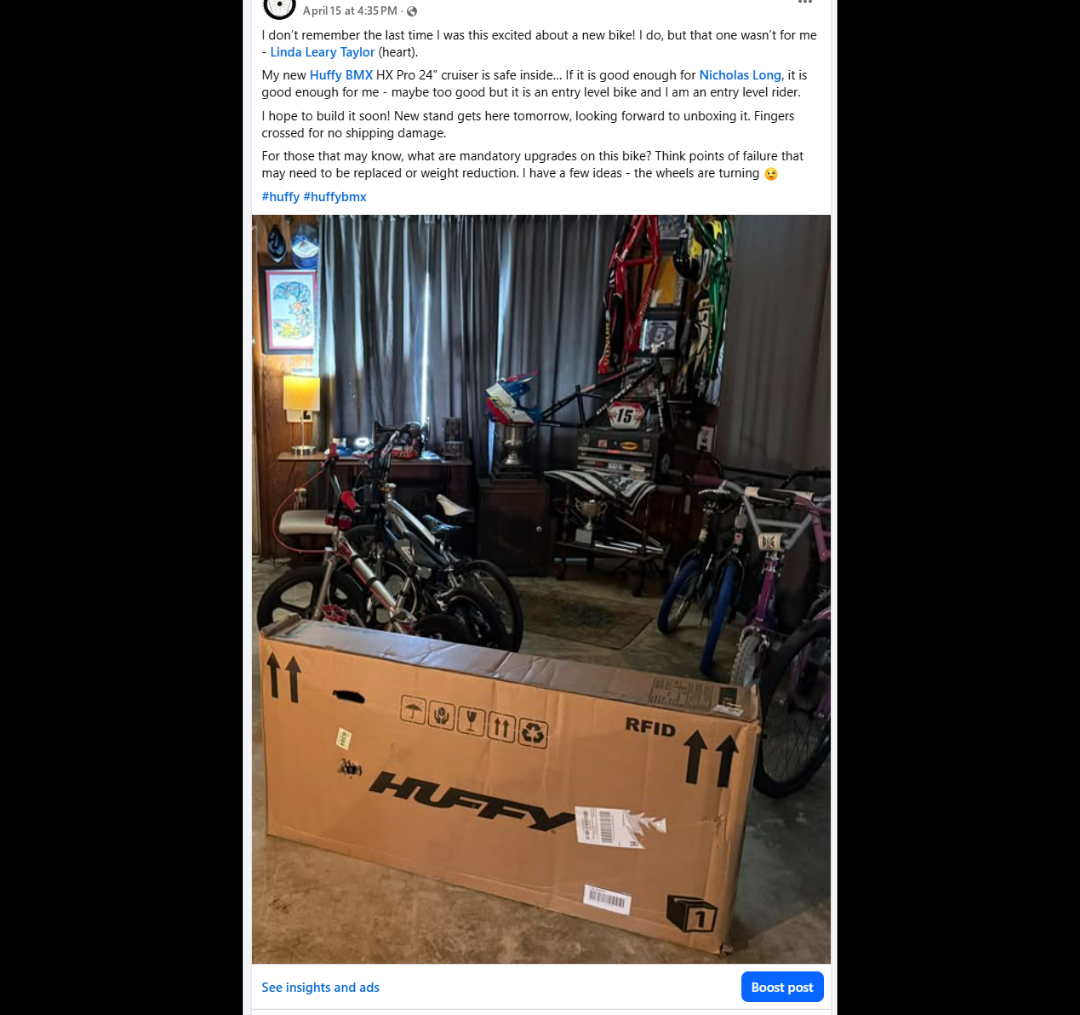 The unopened Huffy box placed inside a room filled with BMX bicycles and archive material.