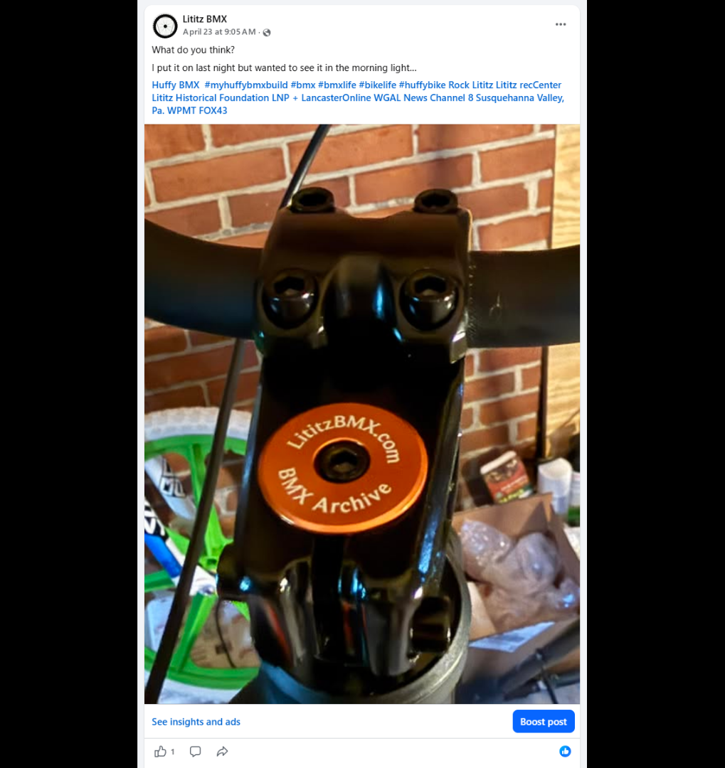 The orange Lititz BMX Archive stem cap installed in the Huffy stem.