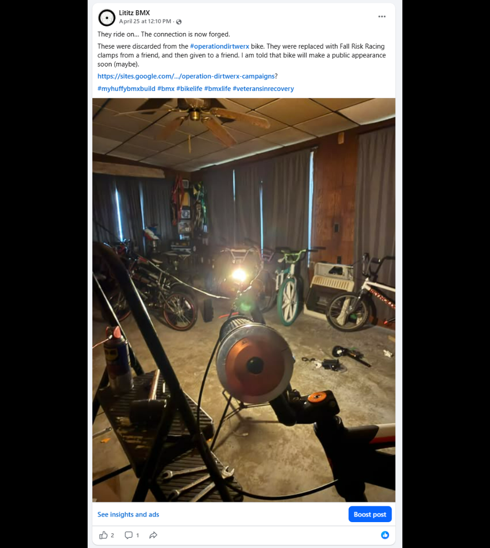 The Huffy in the stand after installation of the recovered clamps, with the developing Harry Leary exhibit visible in the room.
