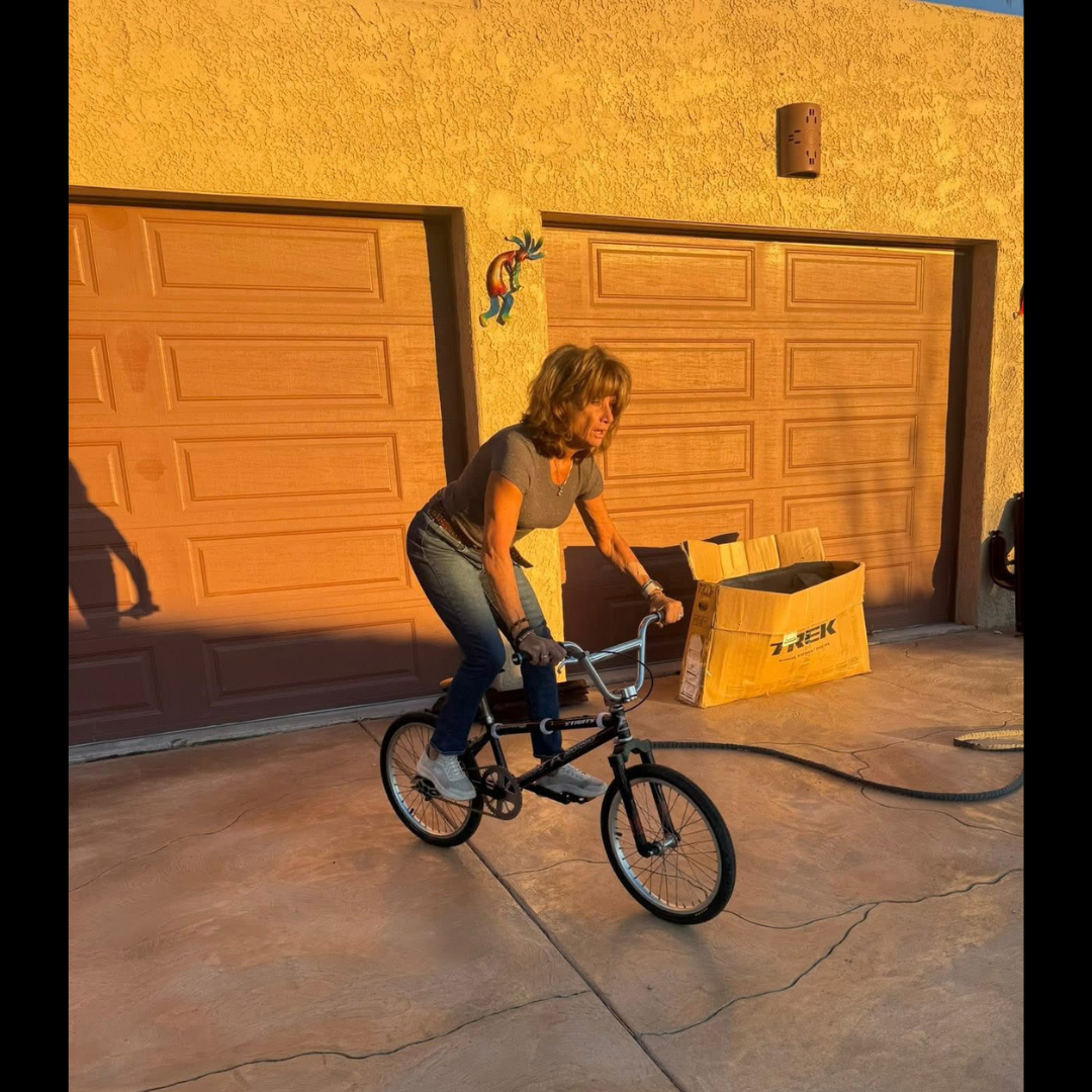 The undated campaign photograph presented as Linda Leary Taylor riding the completed DIRTWERX bicycle.