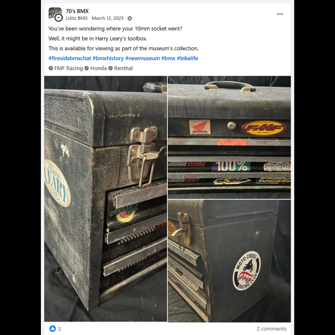 Wear-marked black multi-drawer toolbox with Honda, FMF, Renthal and other racing stickers.