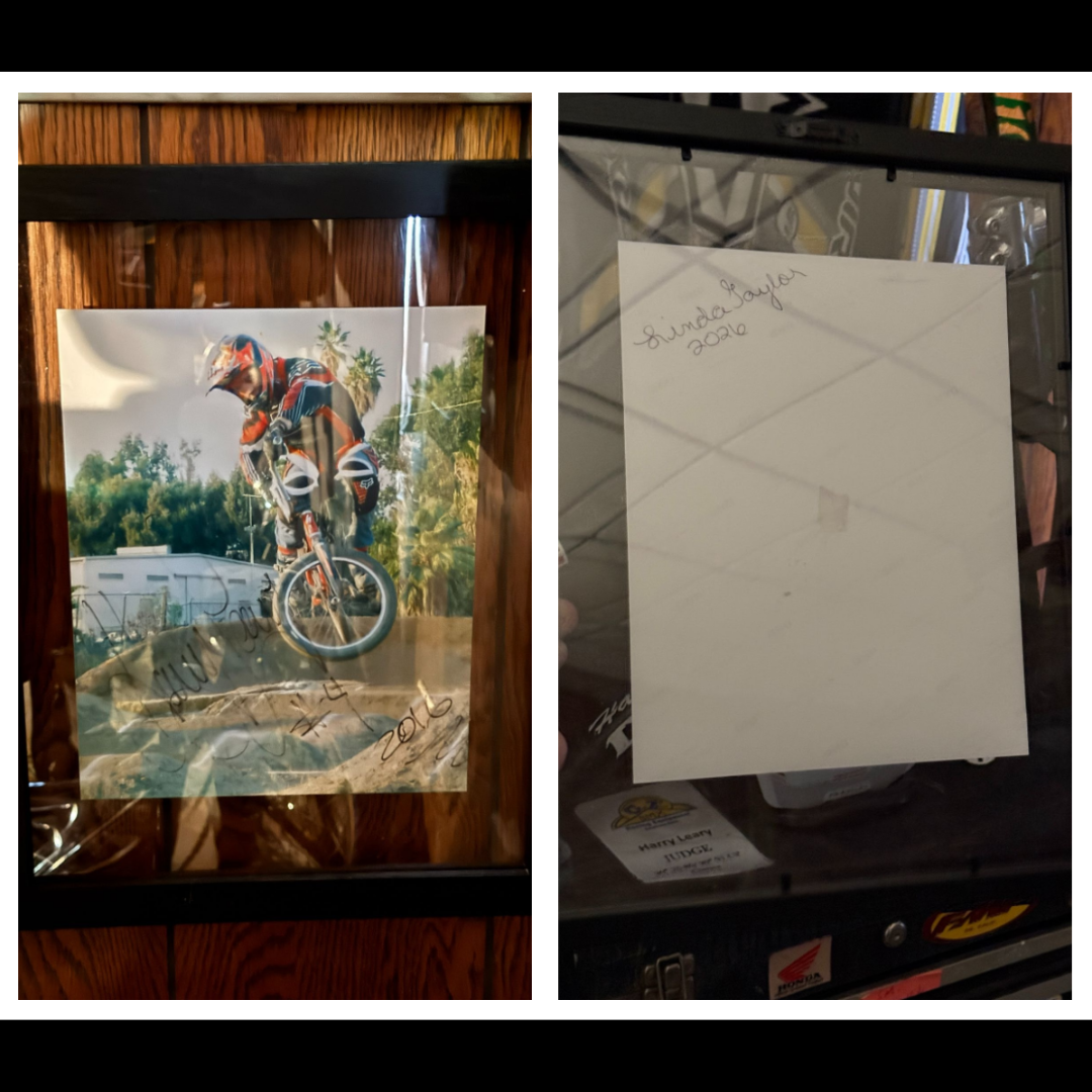 Front and back of a framed signed BMX action photograph or copy associated with Linda and Harry Leary.
