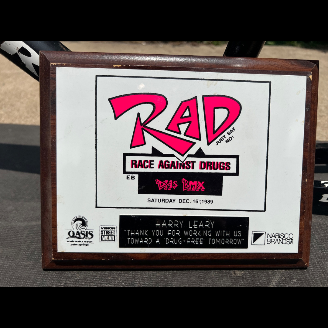 Framed RAD Race Against Drugs plaque dated December 16, 1989, thanking Harry Leary for working toward a drug-free tomorrow.