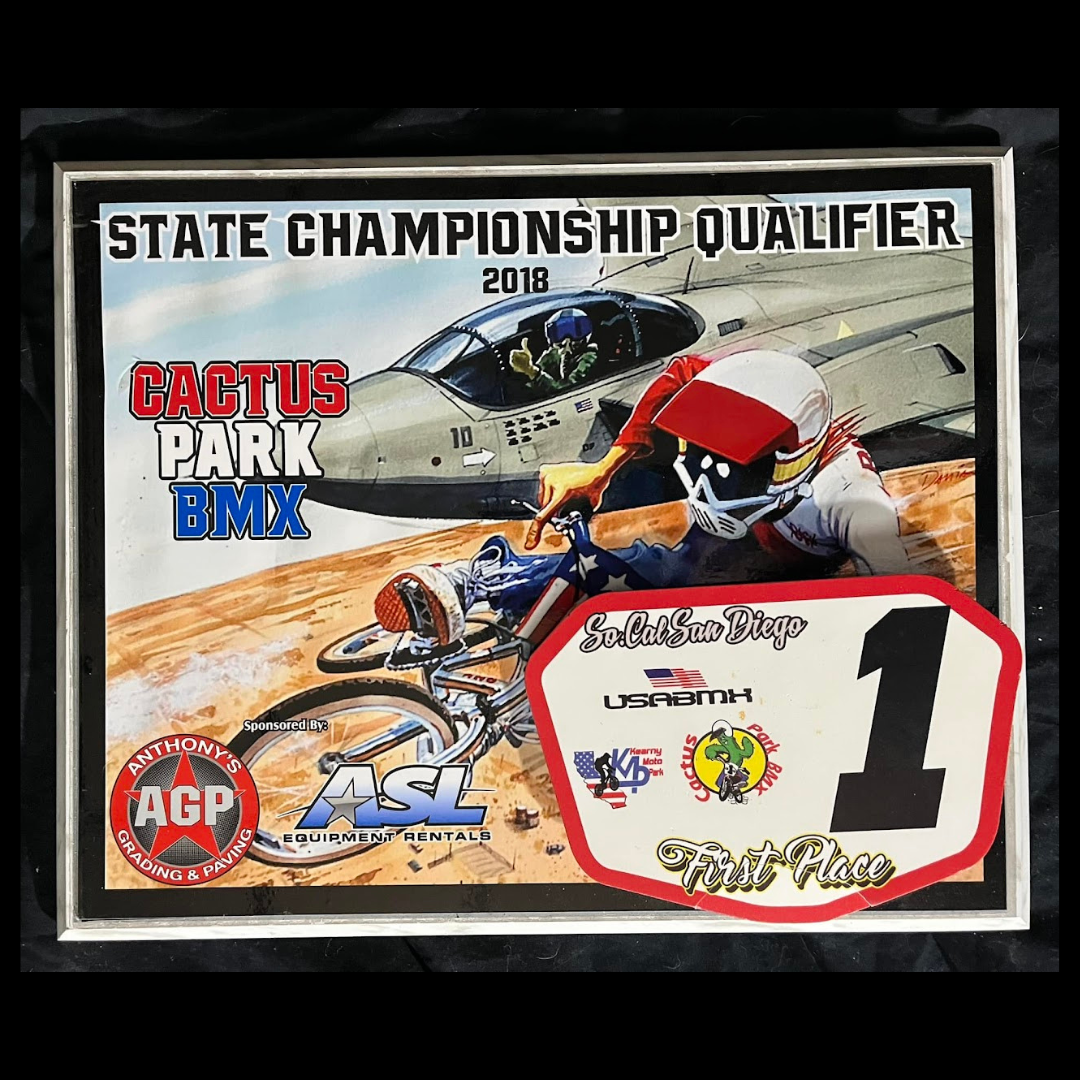 Framed 2018 Cactus Park BMX State Championship Qualifier first-place plaque featuring Radical Rick artwork and a number-one plate.