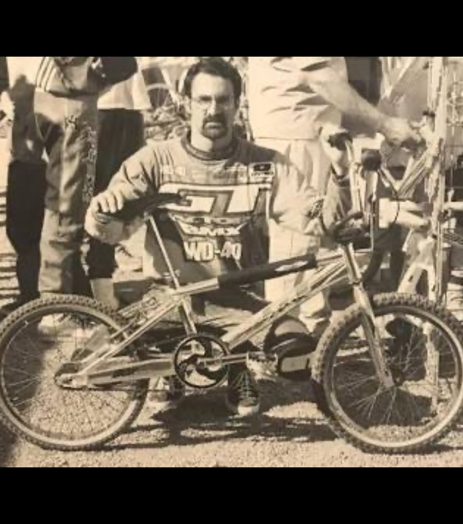Gary Ellis posed with a GT BMX race bike in a vintage black-and-white racing photograph
