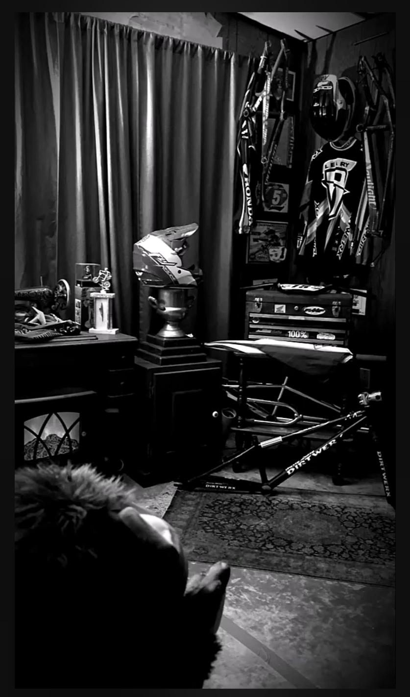 Black-and-white Lititz BMX display photograph showing Harry Leary memorabilia and the preserved DIRTWERX bicycle.